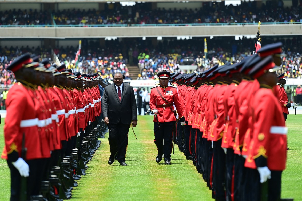 Outgoing Kenyan President Uhuru Kenyatta inspects a guard of honour