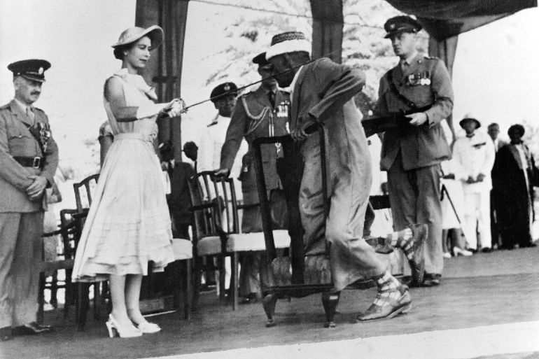 Yemen councillor Sayyid Abubakr bin Shaikh Alkaff kneels before Queen Elizabeth II to be knighted during the Sovereign visit to Aden, on April 29, 1954.