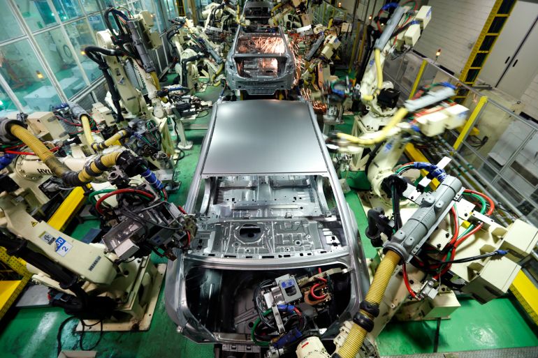 A sedan being assembled in a Hyundai factory in Asan, South Korea.