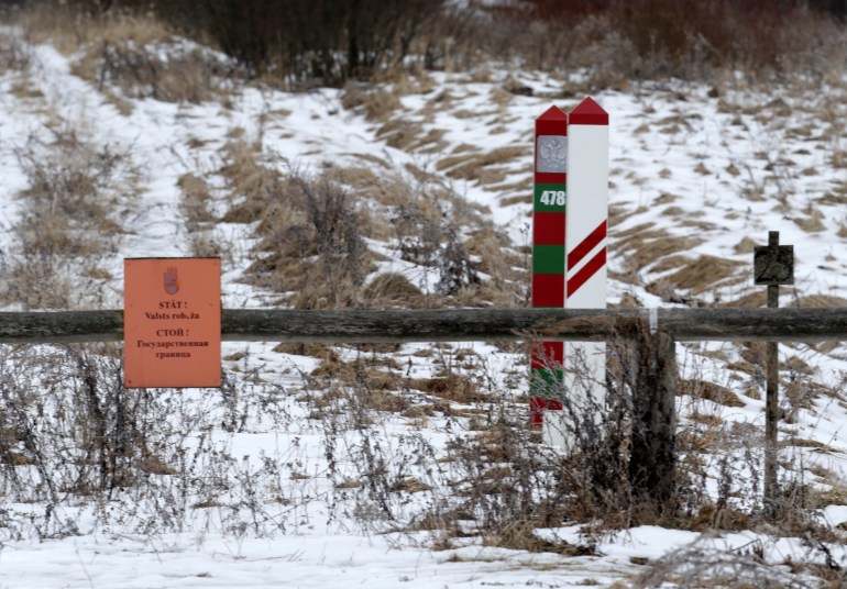 Latvian and Russian border signs are seen in Lavosnieki, Latvia