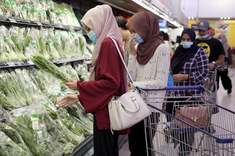 Shoppers in Kuala Lumpur, Malaysia.