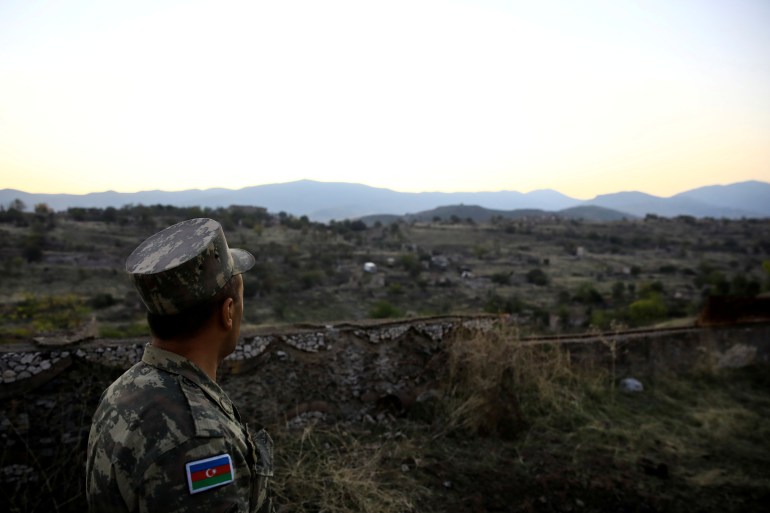 An Azeri soldier is seen standing guard