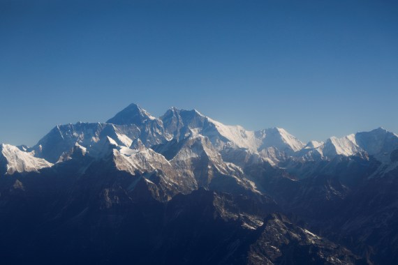 Mount Everest, the world highest peak, and other peaks of the Himalayan range are seen through an aircraft window during a mountain flight from Kathmandu, Nepal January 15, 2020.