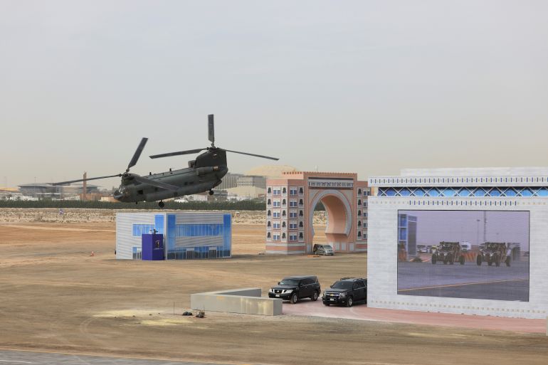 A helicopter in the background of a UAE military base