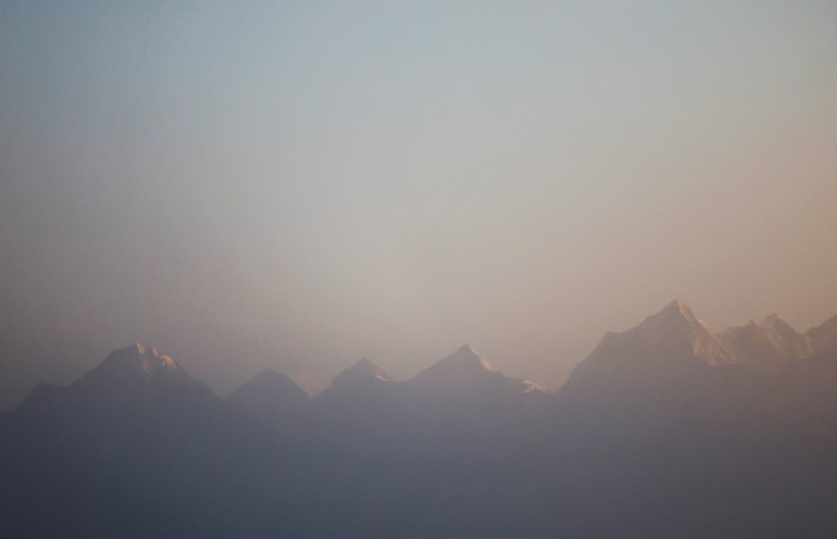 Mount Everest, the world highest peak, and other peaks of the Himalayan range are seen during the sunrise from Ratnange hill in Solukhumbu, Nepal March 27, 2022.