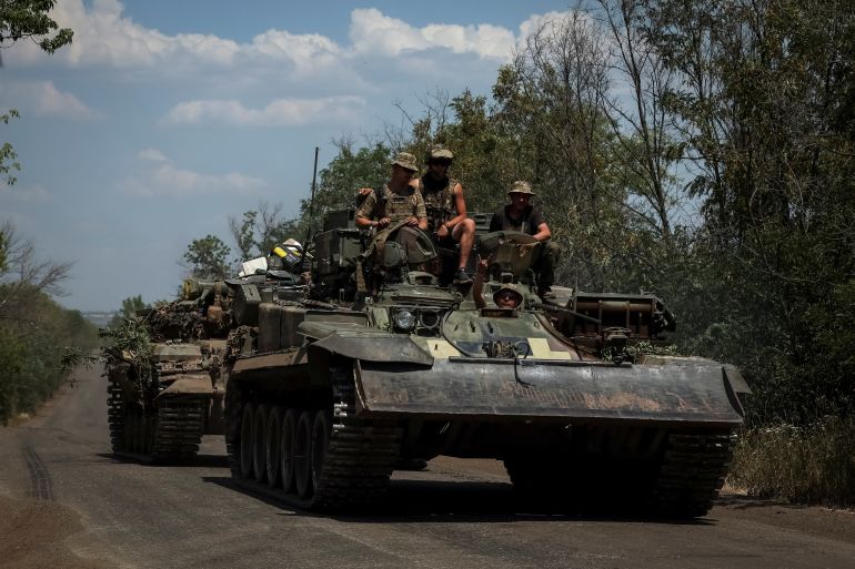 Ukrainian servicemen ride on a military vehicle, amid Russia's attack on Ukraine, in Donetsk region, Ukraine July 8, 2022. REUTERS/Gleb Garanich