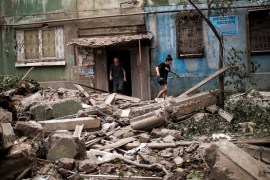 Locals exit a destroyed building following a Russian missile strike in Kostiantynivka, Ukraine [File: Alkis Konstantinidis/Reuters]