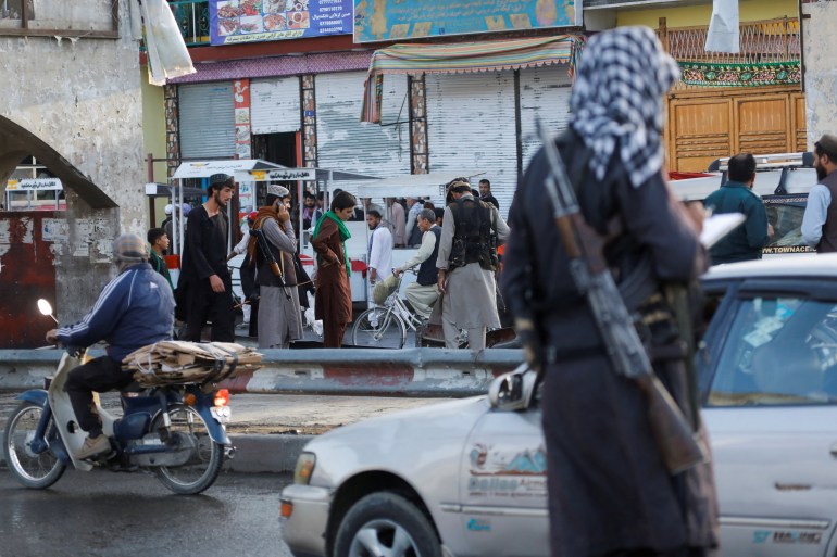 Taliban fighters stand guard at the site of a blast in Kabul, Afghanistan, August 6, 2022.
