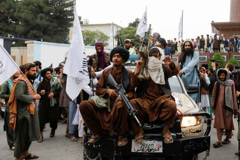 Taliban supporters rejoice on the first anniversary of the fall of Kabul on a street in Kabul, Afghanistan, August 15, 2022.