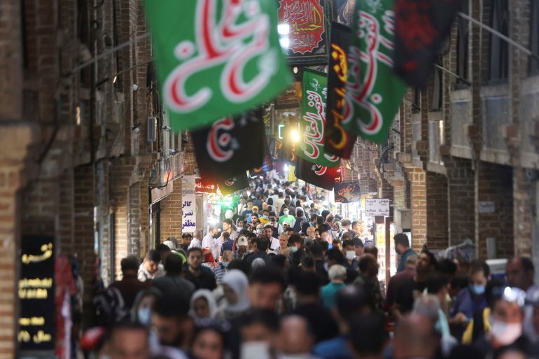 Iranians walk through Tehran Bazaar, in Tehran, Iran August 16, 2022