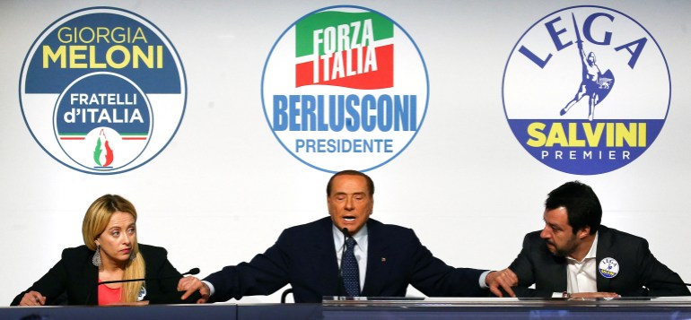 Forza Italia leader Silvio Berlusconi speaks flanked by Fratelli D'Italia party leader Giorgia Meloni and Northern League leader Matteo Salvini during a meeting in Rome, Italy,