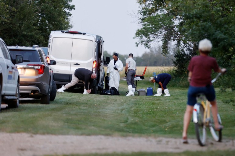 A forensics team investigates a crime scene in Saskatchewan, Canada.