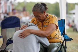 Annie Sanderson comforts her granddaughter on September 5 after a stabbing spree killed 10 people in James Smith Cree Nation and the nearby village of Weldon, Saskatchewan, Canada [David Stobbe/Reuters]
