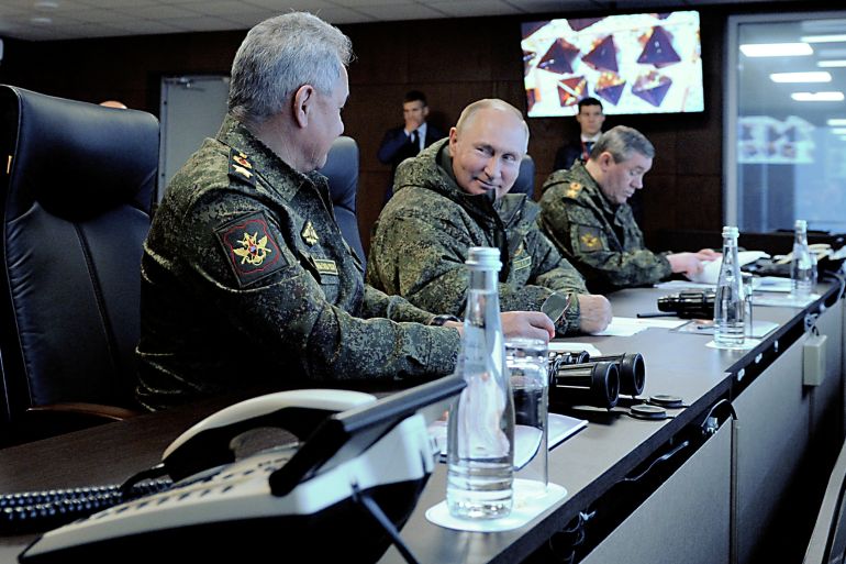 Russian President Vladimir Putin (C), Defence Minister Sergei Shoigu (L) and Chief of the General Staff of Russian Armed Forces Valery Gerasimov oversee the Vostok-2022 (East-2022) military drills at Sergeyevsky training ground in the far eastern Primorsky Region, Russia September 6, 2022