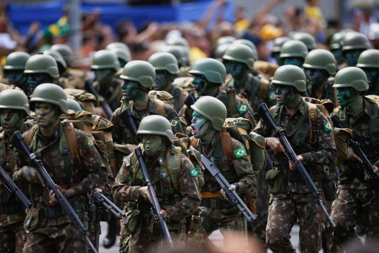 Soldiers march in a military parade to celebrate Brazil's Independence Day, in Brasilia