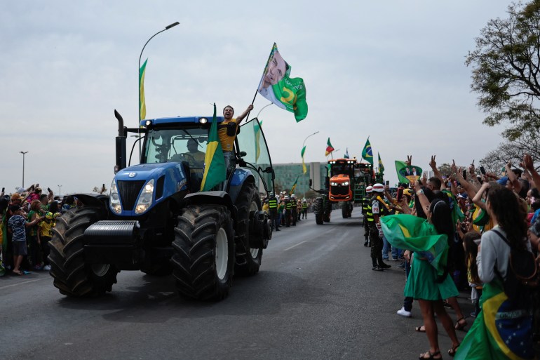 Supporters of Bolsonaro take part in a procession in Brasilia