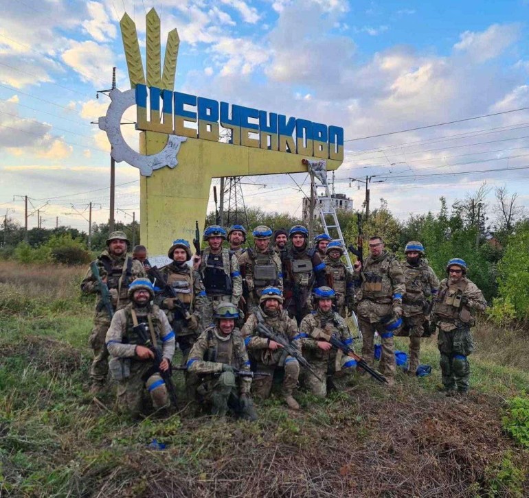 Ukrainian service members pose