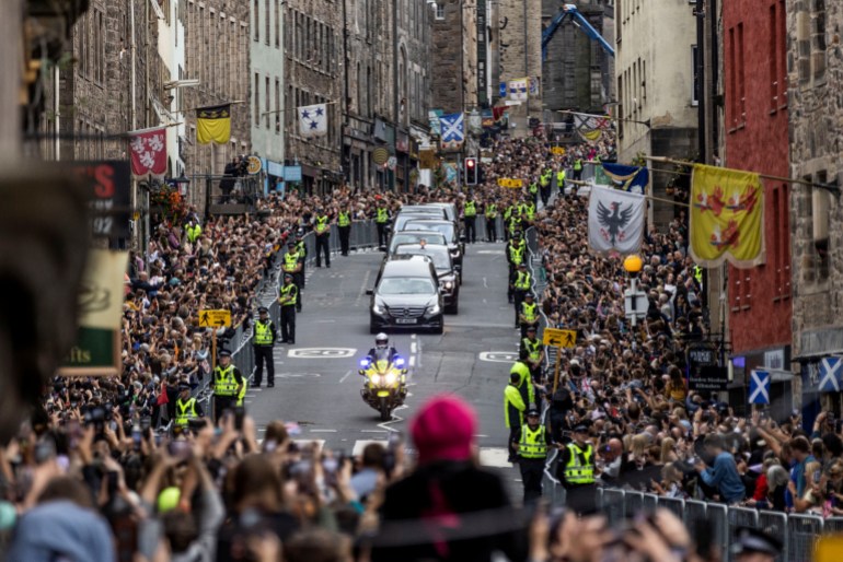 huge crowds line the pavements as Queen Elizabeth's funeral cortege passes down the Royal Mile in Edinburgh