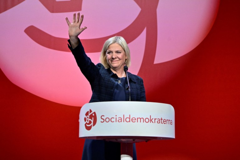 Prime Minister and Social Democratic party leader Magdalena Andersson waves to supporters at a party election event