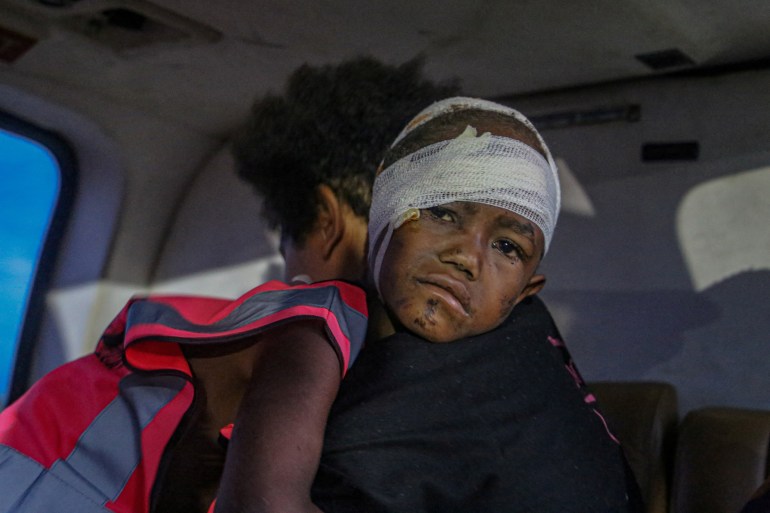 A victim is airlifted following an earthquake, in Obura-Wonenara, Papua New Guinea, September 11, 2022 [Manolos Aviation/Handout/Reuters]