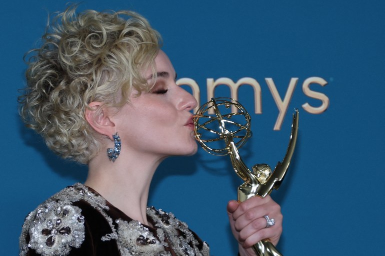 Julia Garner kisses her Emmy for best supporting actress in a drama series