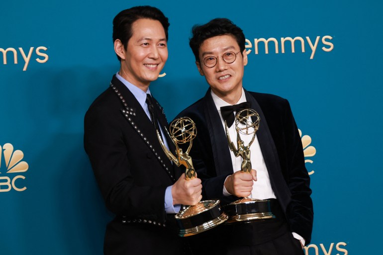 Lee Jung-jae holds his Emmy for Outstanding Lead Actor In A Drama Series for "Squid Game" and Hwang Dong-hyuk for directing
