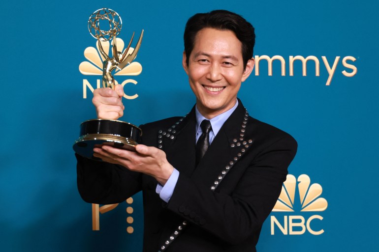 Lee Jung-jae holds his trophy for Outstanding Lead Actor In A Drama Series for "Squid Game" at the 74th Primetime Emmy Awards