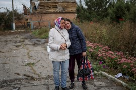 Two Ukrainian women stand in village of Verbivka in Kharkiv region