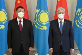 Chinese President Xi Jinping and Kazakh President Kassym-Jomart Tokayev pose for a picture during a meeting in Nur-Sultan