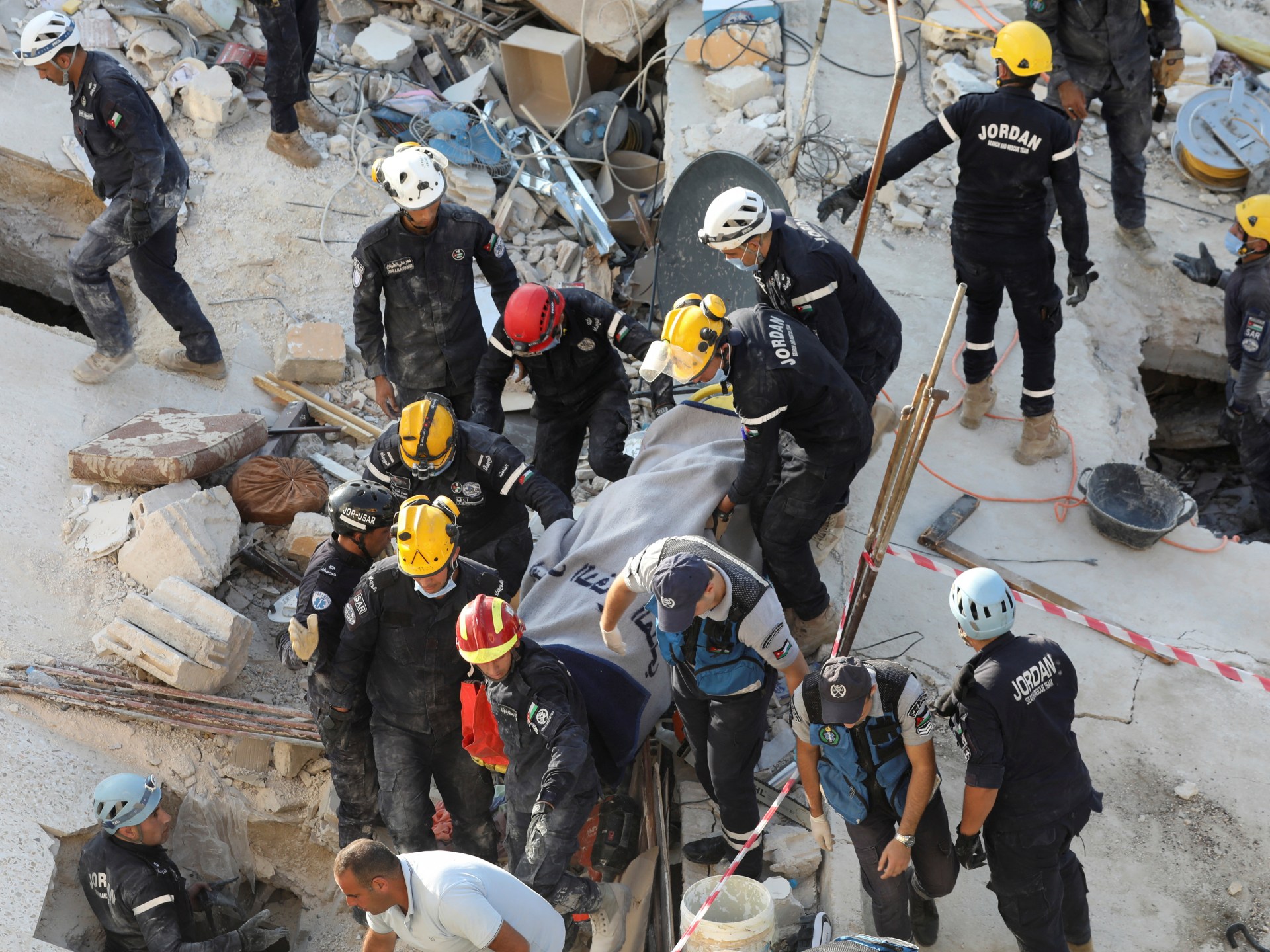 Amman building collapse: Baby saved as rescue efforts continue