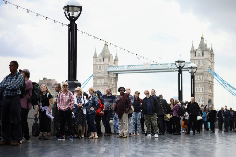 People queue near Tower Bridge
