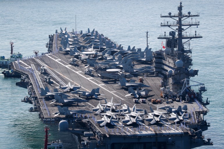 The USS Ronald Reagan approaches a port in Busan, South Korea, on September 23, 2022 [Yonhap via Reuters]
