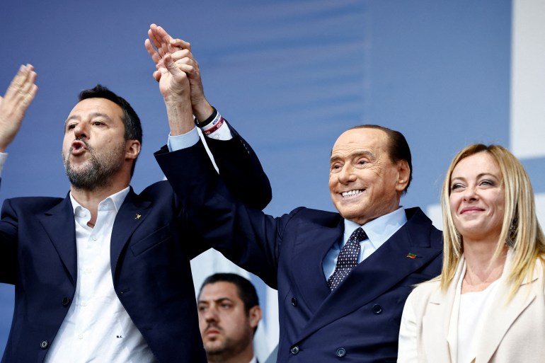 League leader Matteo Salvini, Forza Italia leader Silvio Berlusconi and Brothers of Italy leader Giorgia Meloni speak at the closing electoral campaign rally of the centre-right coalition.