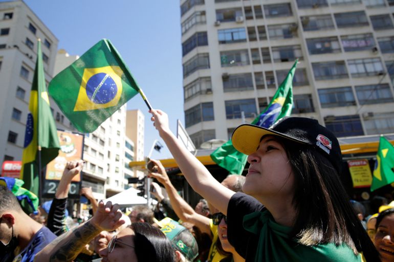 Supporters of Brazil's President and candidate for re-election Jair Bolsonaro attend a campaign rally in Campinas, Sao Paulo state, Brazil, September 24, 2022.