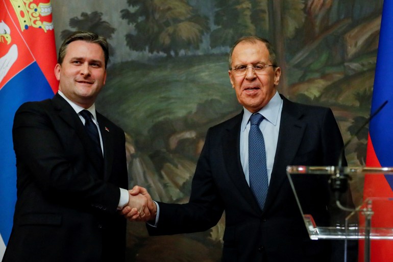 Russian Foreign Minister Sergei Lavrov shakes hands with Serbian Foreign Minister Nikola Selakovic