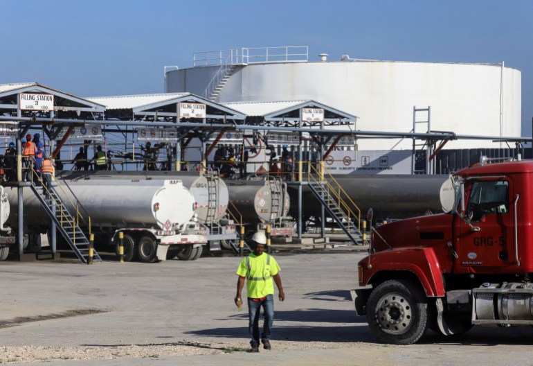 Tank trucks being filled at a fuel terminal in Haiti
