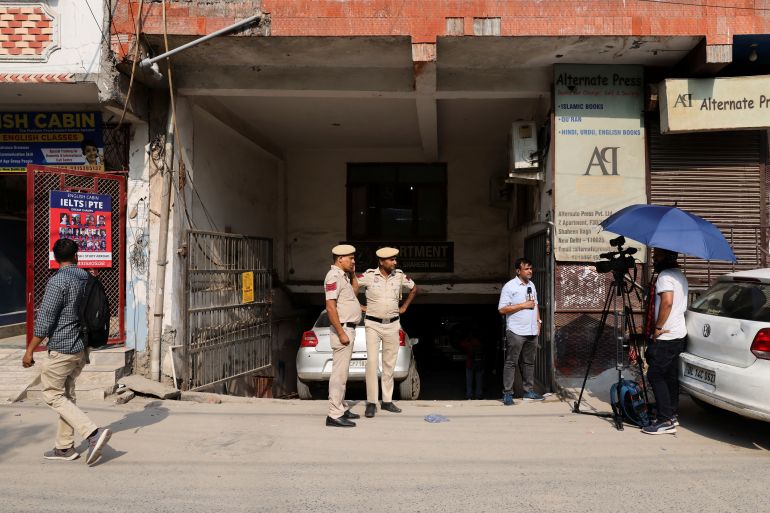 Media and policemen stand outside the office of Popular Front of India (PFI) Islamic group, in New Delhi, India, September 28, 2022. REUTERS/Anushree Fadnavis