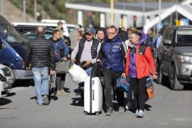 Russians are seen attempting to leave their country to avoid a military call-up for the Russia-Ukraine war as queues form at the Kazbegi border crossing in Stepantsminda, Georgia on September 27, 2022 [Mirian Meladze/Anadolu Agency]