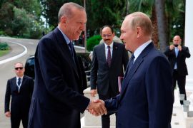 Russian President Vladimir Putin, (right), greets Turkish President Recep Tayyip Erdogan upon his arrival at the Rus sanatorium in the Black Sea resort of Sochi, Russia, Friday, Aug. 5, 2022. Erdogan's spokesman Ibrahim Kalin is the center. Turkish President Recep Tayyip Erdogan traveled to Russia Friday for talks with Russian President Vladimir Putin expected to focus on a grain deal brokered by Turkey, prospects for talks on ending hostilities in Ukraine, and the situation in Syria. (Vyacheslav Prokofyev, Sputnik, Kremlin Pool Photo via AP)