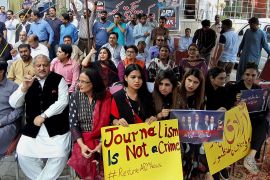Journalists and employees of the private news channel ARY hold a protest in August in Islamabad against their channel being taken off the air. Pakistani authorities revoked its broadcast permit for airing an interview with an opposition party official who was accused of inciting soldiers and officers against the military leadership. [File: AP]