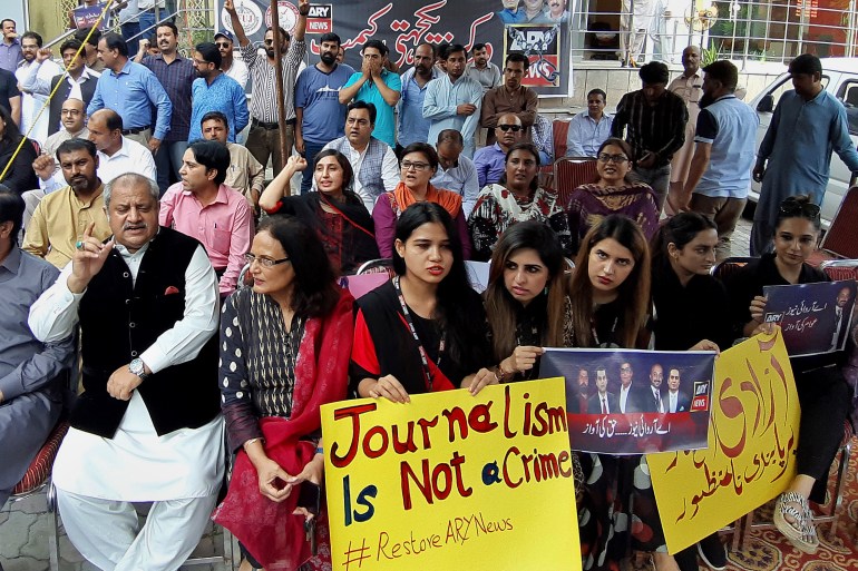 Journalists and employees of a private news channel ARY hold a protest against their channel being taken off-air by the Pakistan media regulator authority