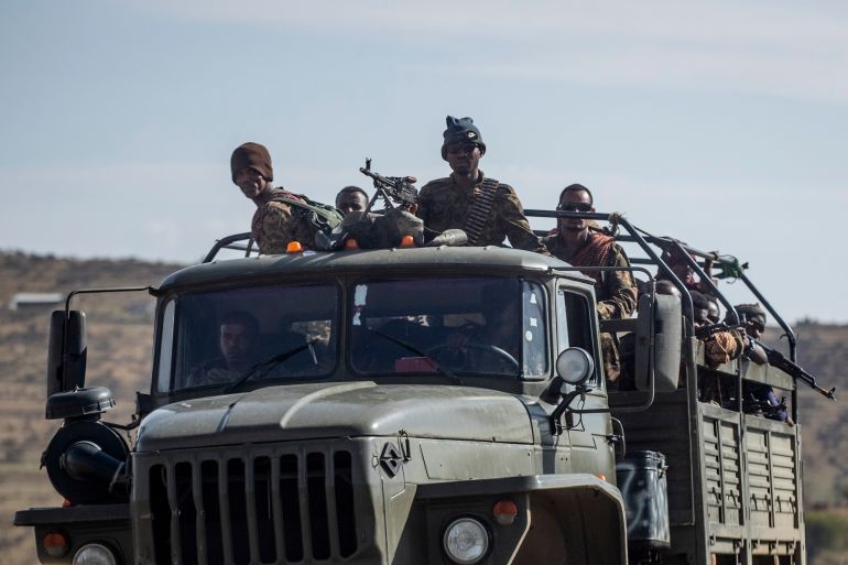 Ethiopian government soldiers ride in the back of a truck north of Mekele.