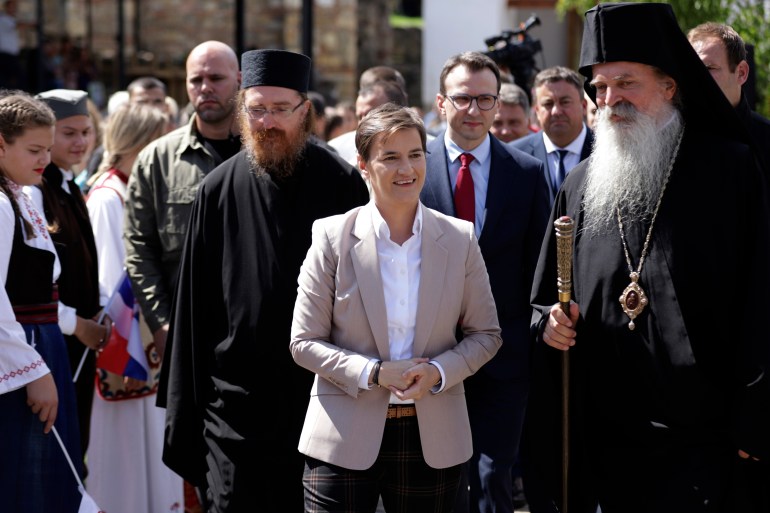 Serbian Prime Minister Ana Brnabic, centre, arrives in the Banjska Orthodox monastery with Serb Orthodox bishop Teodosije in the village Banjska, 15km north of Mitrovica, Kosovo