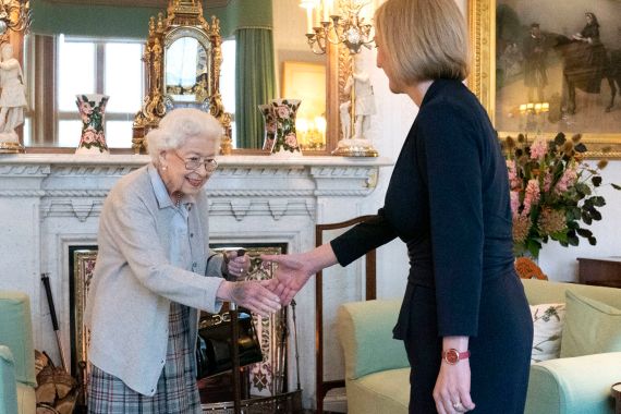 Britain's Queen Elizabeth II, left, welcomes Liz Truss during an audience at Balmoral, Scotland,