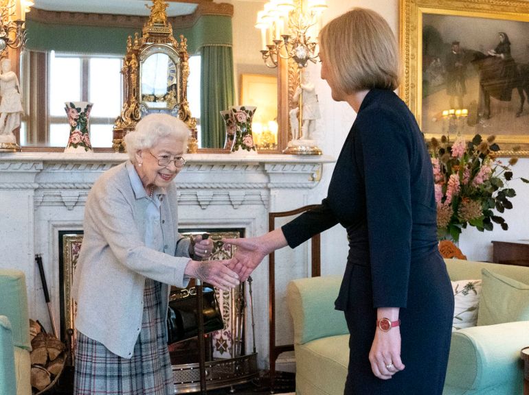 Britain's Queen Elizabeth II, left, welcomes Liz Truss during an audience at Balmoral, Scotland,
