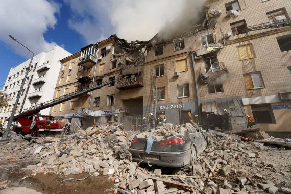 Ukrainian firefighters work on heavily damaged buildings after latest Russian rocket attack in the centre of Kharkiv, Ukraine.