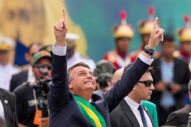Brazil&#39;s President Jair Bolsonaro points up during a military parade to celebrate the bicentennial of the country&#39;s independence from Portugal, in Brasília, on September 7, 2022 [File: Eraldo Peres/AP Photo] (