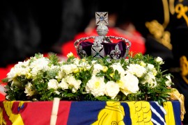 The Imperial State Crown rests on the coffin of Queen Elizabeth II during a procession from Buckingham Palace to Westminster Hall in London, Wednesday, Sept. 14, 2022. The Queen will lie in state in Westminster Hall for four full days before her funeral on Monday Sept. 19. (AP Photo/Kirsty Wigglesworth)