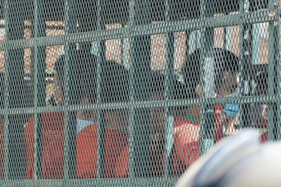 People on a prison truck arrive at the Phnom Penh Municipal Court in Phnom Penh, Cambodia, on Thursday, Sept. 15, 2022 [Heng Sinith/AP]