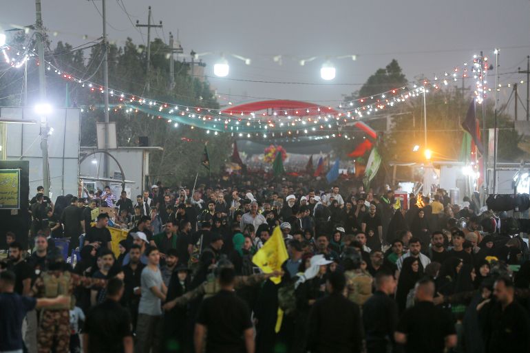 Shiite pilgrims walk to then city of Karbala, Iraq, to mark the holiday of Arbaeen, Wednesday, Sept. 14, 2022